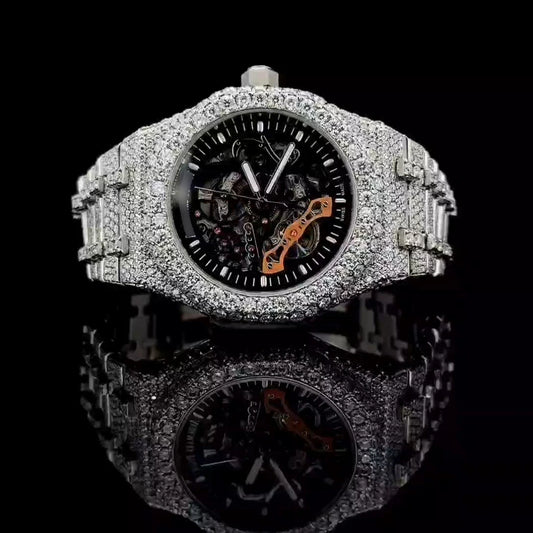 Moissanite iced out skeleton watch with rhodium automatic movement and round cut stones.